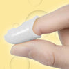 A hand wearing a white silicone guitar finger sleeve for practice and protection.