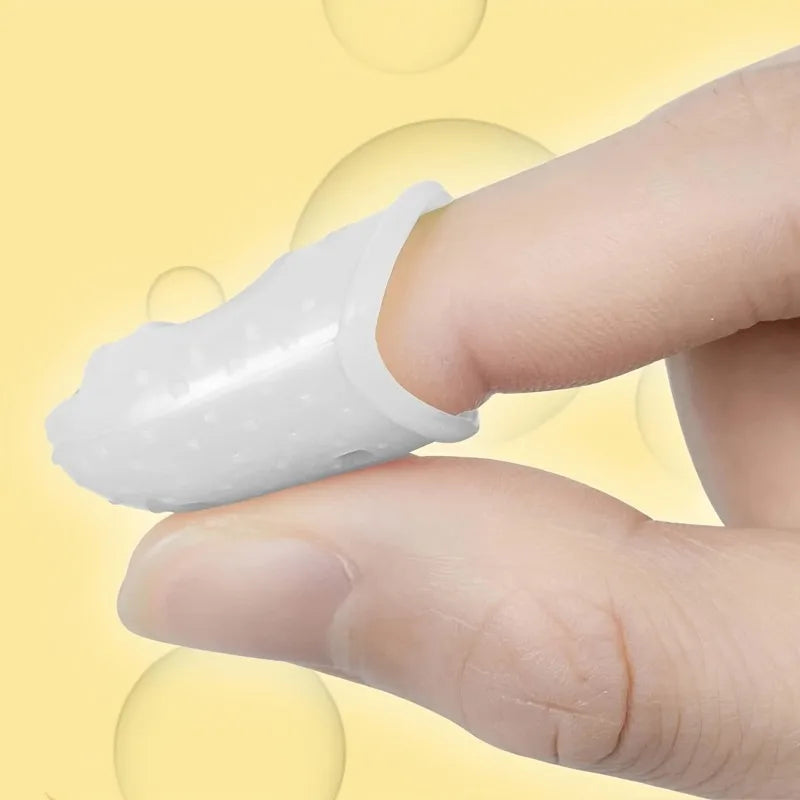 A hand wearing a white silicone guitar finger sleeve for practice and protection.