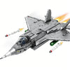 A detailed gray J35 fighter jet model kit built from building blocks, shown in flight with missile trails.
