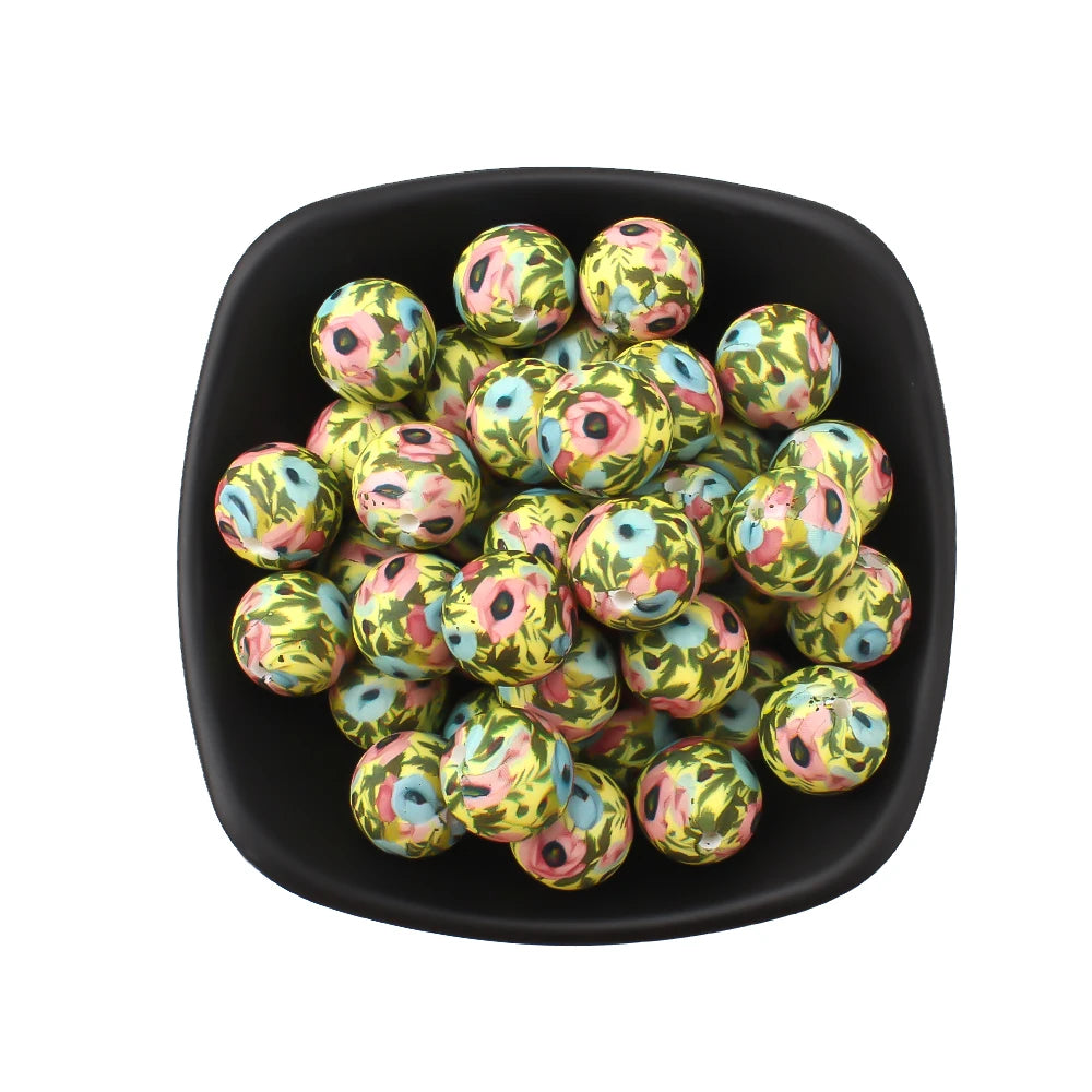 A black bowl filled with small, round silicone beads featuring a leopard and daisy print.