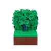 A LEGO building block model of Homer in the bushes scene featuring green foliage and a brown base.