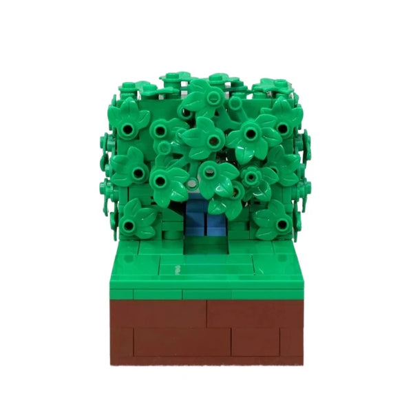 Maquette LEGO de Homer dans les buissons avec feuillage vert et base marron