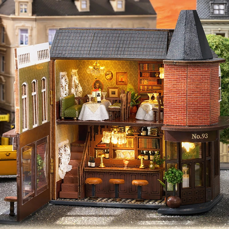 A detailed wooden dollhouse kit of a pink princess villa with interior lighting and display shelves.