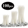 A collection of white pre-waxed cotton candle wicks with metal sustainers.