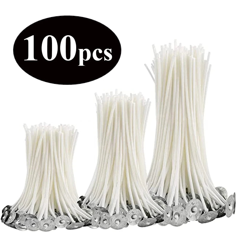 A collection of white pre-waxed cotton candle wicks with metal sustainers.