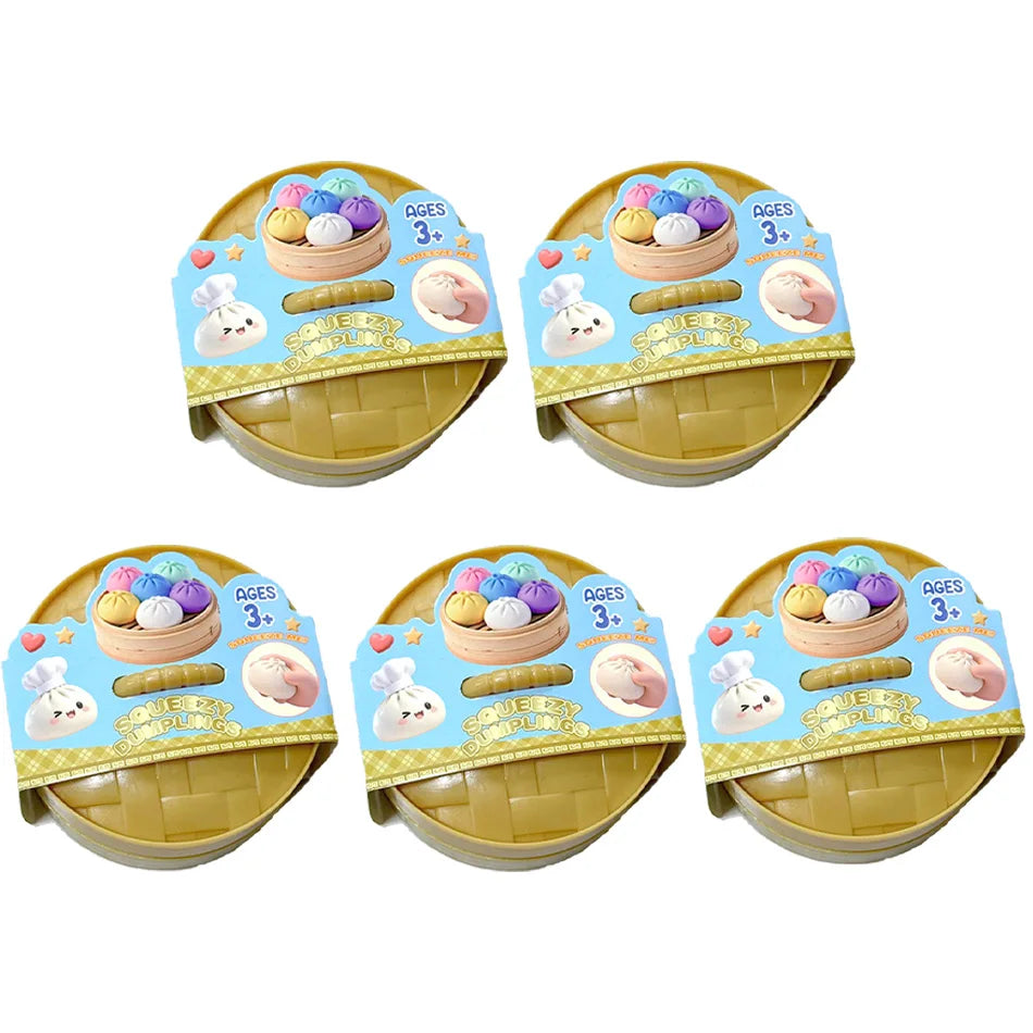 A set of three colorful glitter dumpling squishy toys packaged in yellow and blue cardboard boxes.
