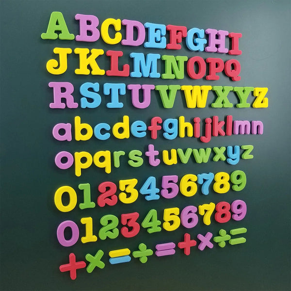 A collection of colorful magnetic alphabet and number letters arranged in rows on a dark green surface.