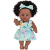 A 12-inch realistic African American baby doll with curly hair wearing a light blue dress and bow