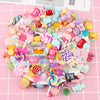 Assorted colorful candy resin flatbacks and small candies for DIY crafts and jewelry making