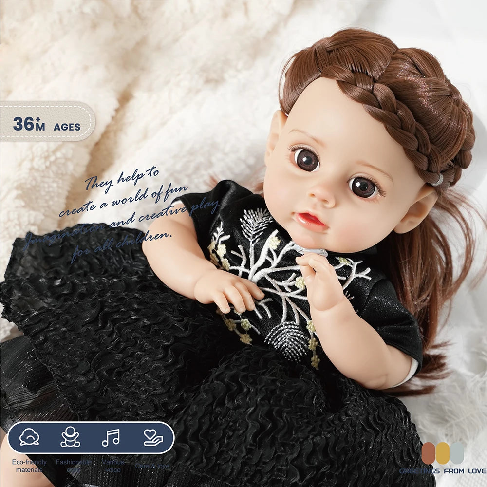 A lifelike 14-inch reborn baby doll with a dark outfit and hair, shown in a close-up.