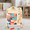 A wooden Tetris puzzle board with colorful geometric shapes and an arched opening for toddlers.