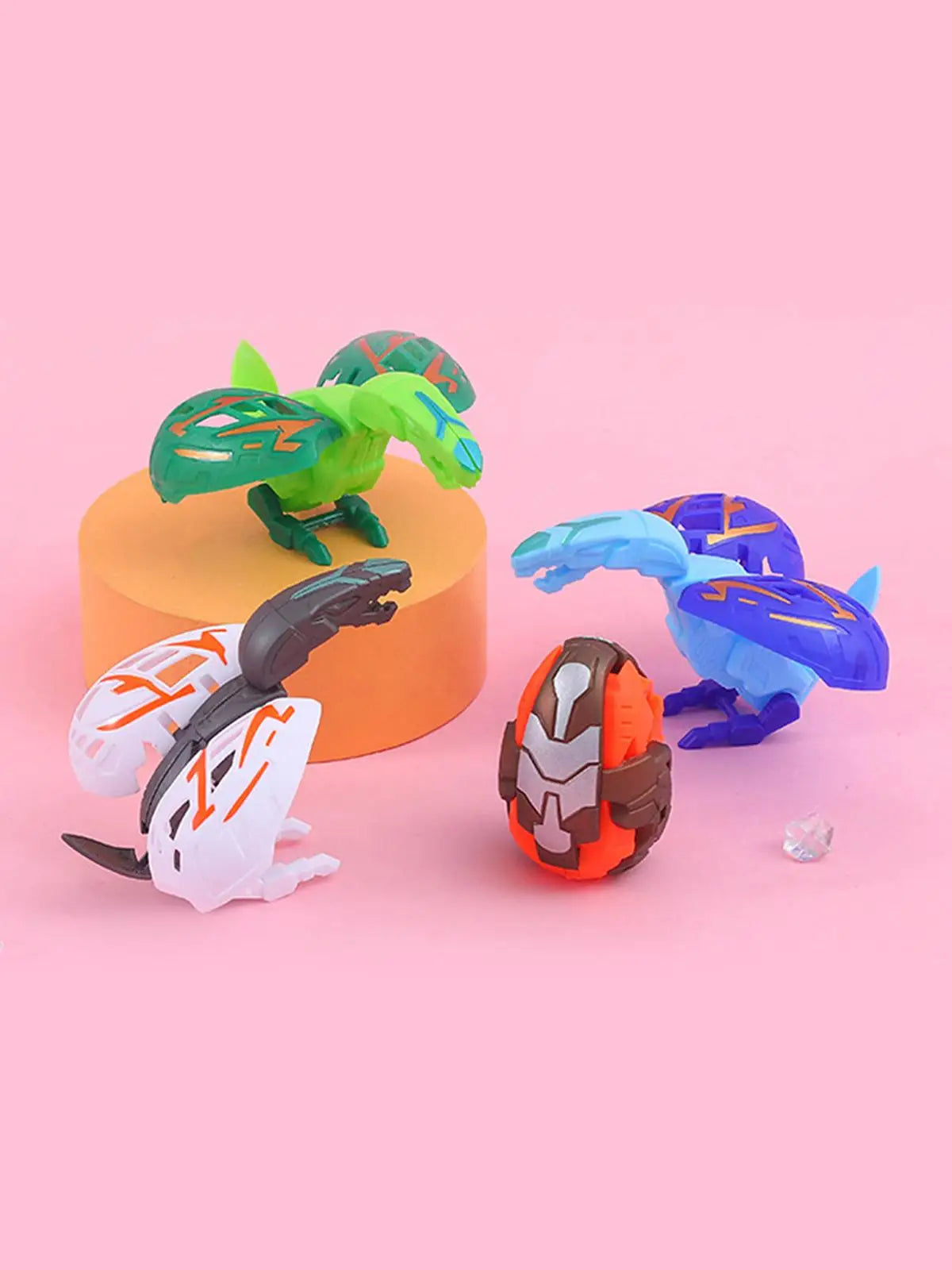 A green and yellow dinosaur egg toy is displayed next to a white and black dinosaur figure on an orange stand.