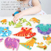 A box of wooden animal jigsaw puzzles for children, featuring various colorful animals like a tiger and a dinosaur.