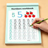 A hand writes the number five in a workbook titled Numbers workbook for kids.