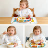 Two babies are shown eating food with waterproof full sleeve baby bibs on a wooden table.