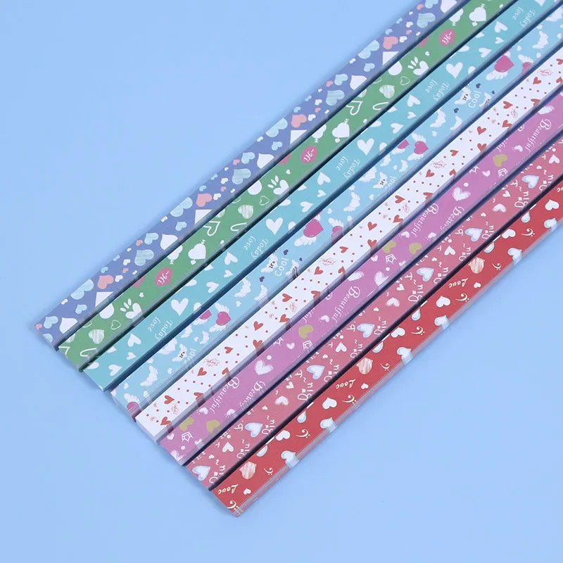A diagonal arrangement of 27 colorful origami star strips for DIY crafting and decor.