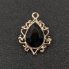 Gold plated water droplet charm featuring a black crystal and an ornate flower design.