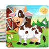 A jigsaw puzzle featuring a cartoon cow in a field with a barn and a rising sun.