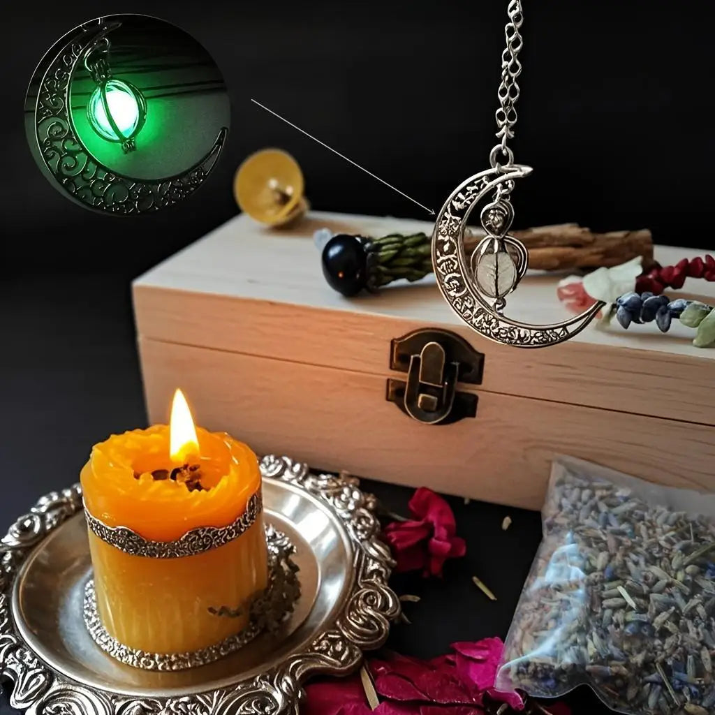 A witchcraft starter kit featuring a wooden box, crystals, herbs, and a lit candle on a silver tray.