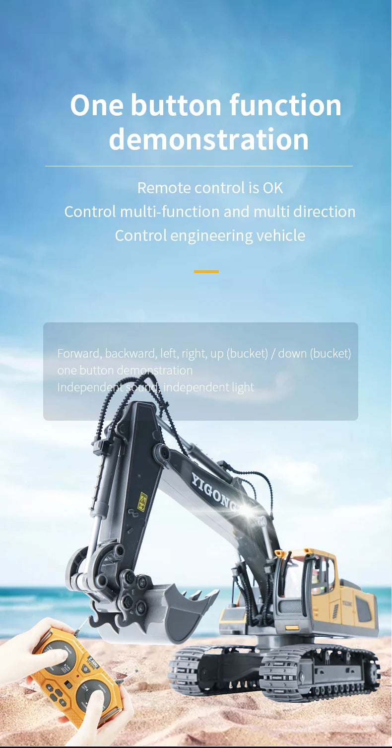 A close-up of a yellow remote control construction excavator truck with an attached hydraulic arm, being operated by a hand.