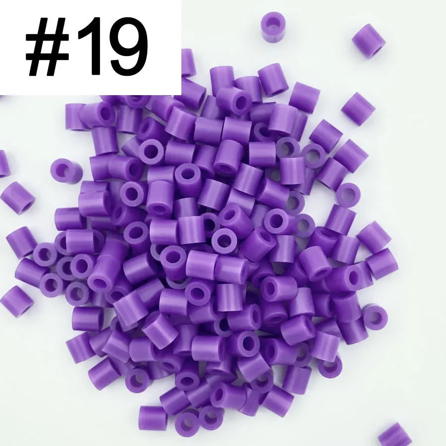 A pile of 1000 purple DIY fuse beads, 5mm in size, for creative craft projects.
