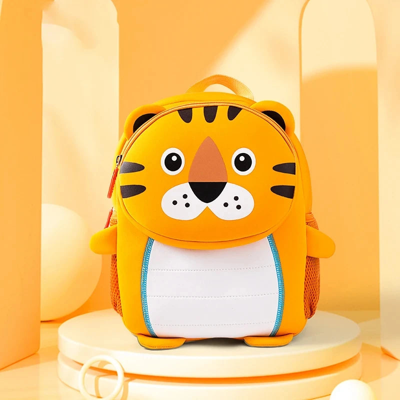 A bright orange tiger-themed backpack for kids with black stripes and white accents.