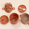 A set of brown silicone stackable bento lunch boxes shaped like an adorable bear, including a main container and a separate s
