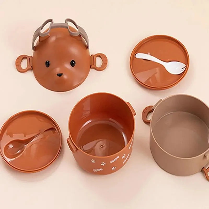 A set of brown silicone stackable bento lunch boxes shaped like an adorable bear, including a main container and a separate s