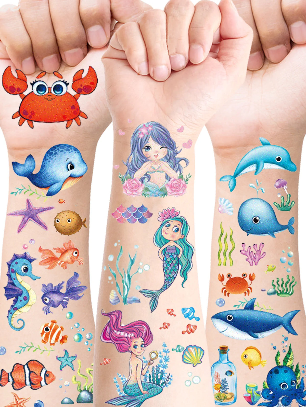 A collection of colorful glitter mermaid and underwater sea creature temporary tattoos on a person's arm.