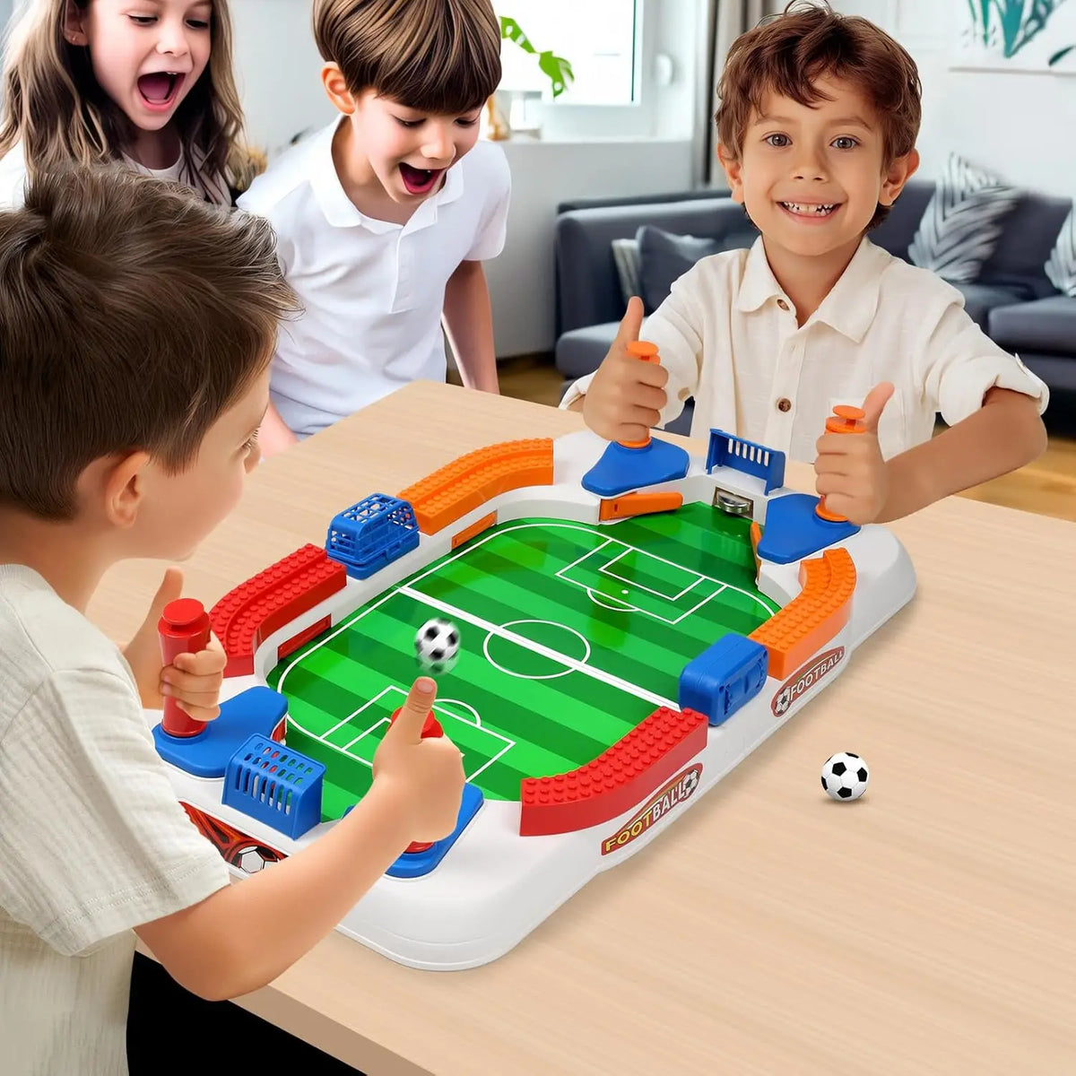 A boy plays a mini tabletop foosball game with double flip control on a wooden table.