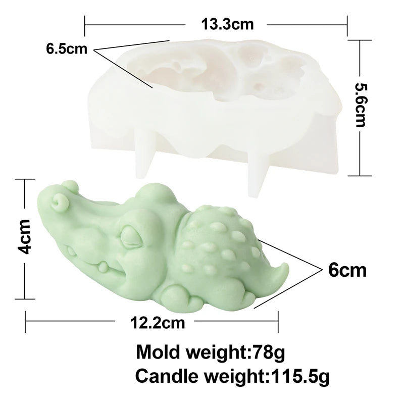A white silicone mold shaped like an elephant, shown next to a candle for scale.