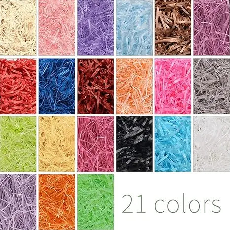 A collection of 21 multicolored raffia paper shreds in various shades including pink, blue, orange, green, and brown.
