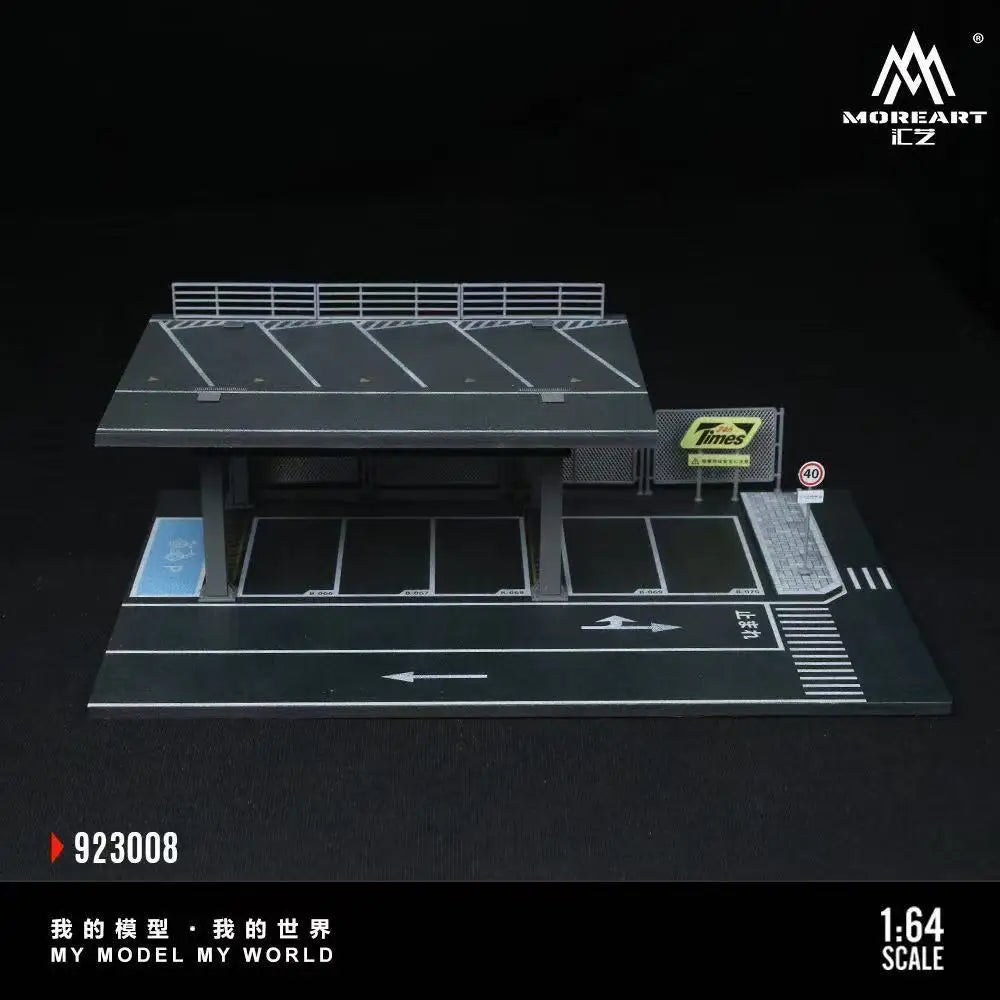 A 1:64 scale mini garage diorama featuring a black and gray model car setup.
