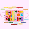 A pink Montessori felt activity busy book for toddlers featuring various zipper, buckle, and felt shapes.