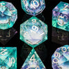 A collection of iridescent blue and teal polyhedral dice, including a d10, d20, and d4, displayed on a reflective surface.