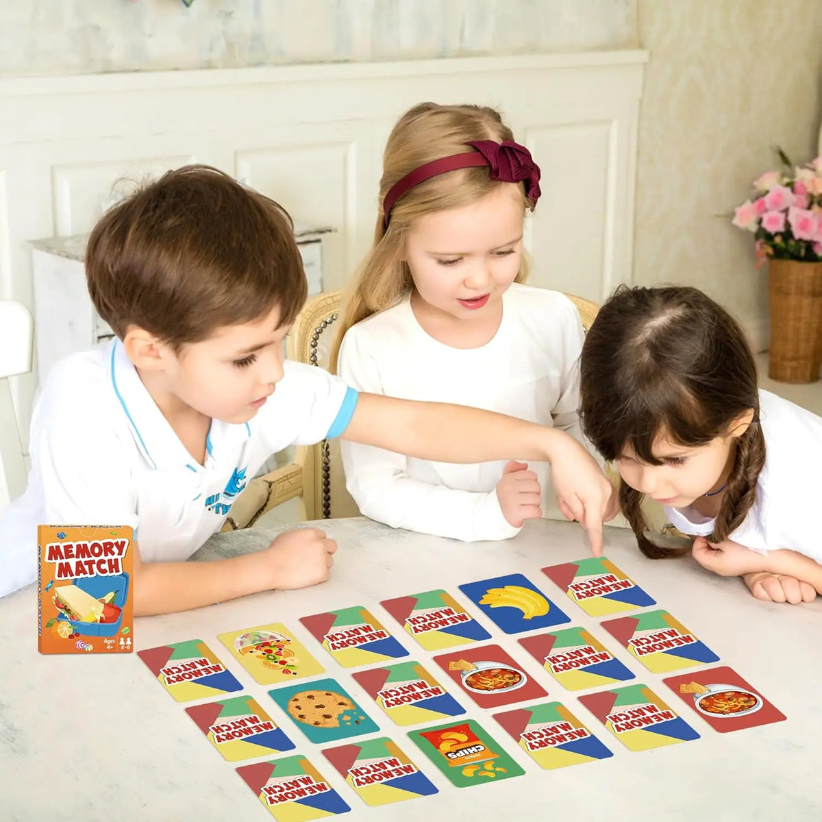 A family playing a Memory Match card game with colorful cards on a table.
