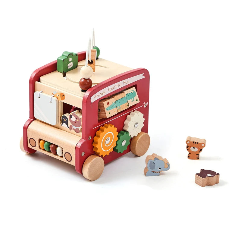A wooden busy board for toddlers featuring various activities and components like a bus and gears.