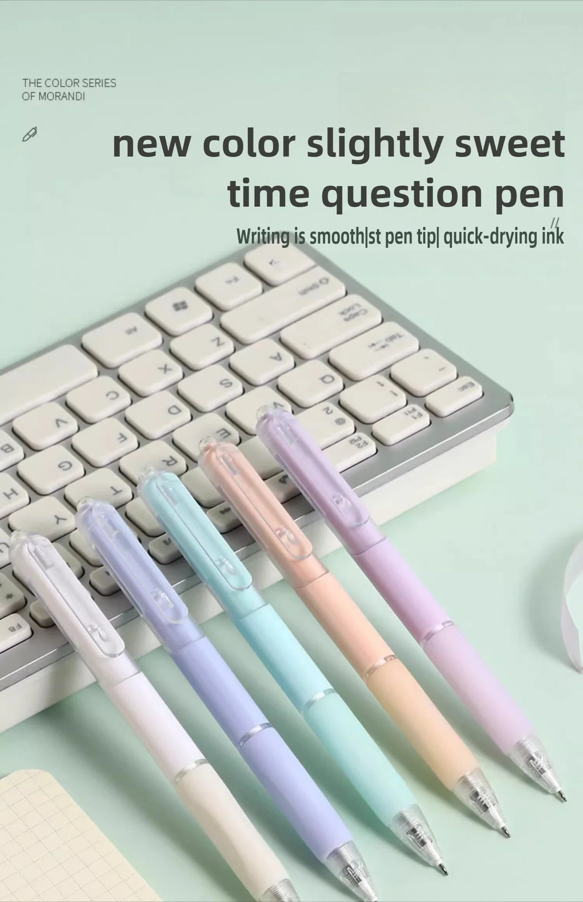 A set of five new color slightly sweet time question pens with smooth tips displayed on a keyboard.