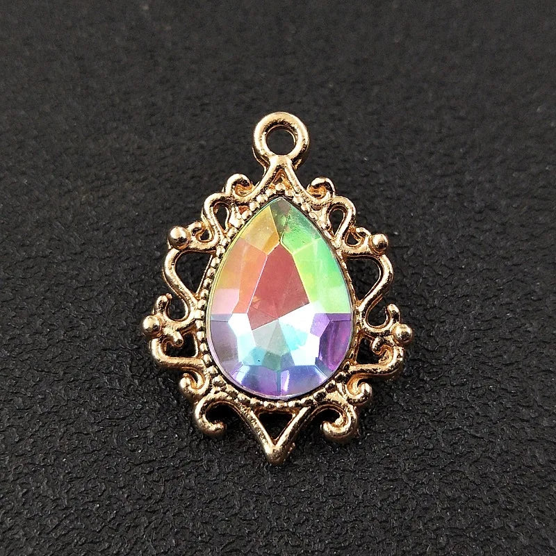 Gold plated water droplet charm featuring a faceted crystal rhinestone set in an ornate flower design.