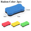 Three magnetic dry erase erasers in blue, red, and green are shown against a white background.