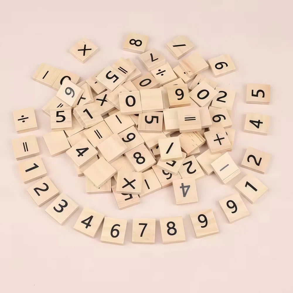 A scattered collection of wooden alphabet letter tiles numbered 0 through 12 arranged in a circular pattern.