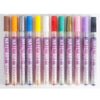 A row of twelve precision nail art markers in various colors, including orange, blue, green, pink, and purple.