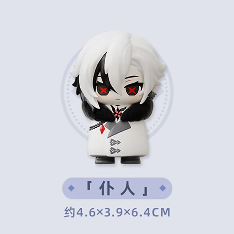 A chibi figurine of a character with white hair and black markings, featuring red eyes and black clothing.