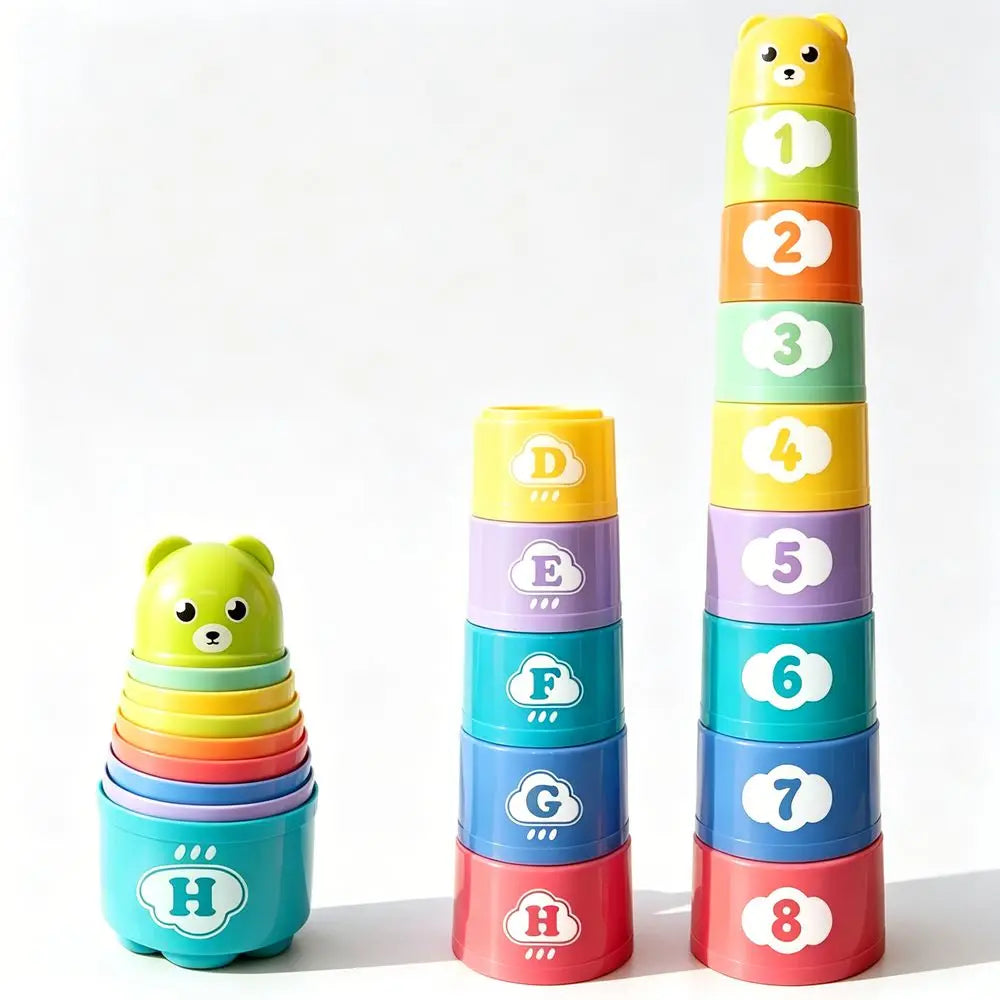 A set of eight colorful stacking cups in rainbow order, numbered one through eight, and a green stacking cup.