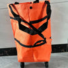 Orange foldable shopping cart with black straps and wheels