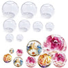 A collection of clear silicone sphere molds used for resin crafting, showing various sizes and shapes.