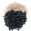 A pile of black plastic safety eyes with washers for crafting and stuffed animals
