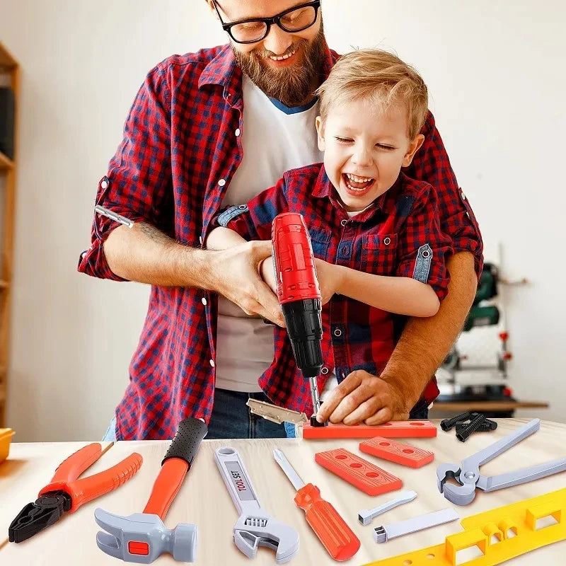 A man is demonstrating a kids' pretend play tool set with an electric drill to a child.