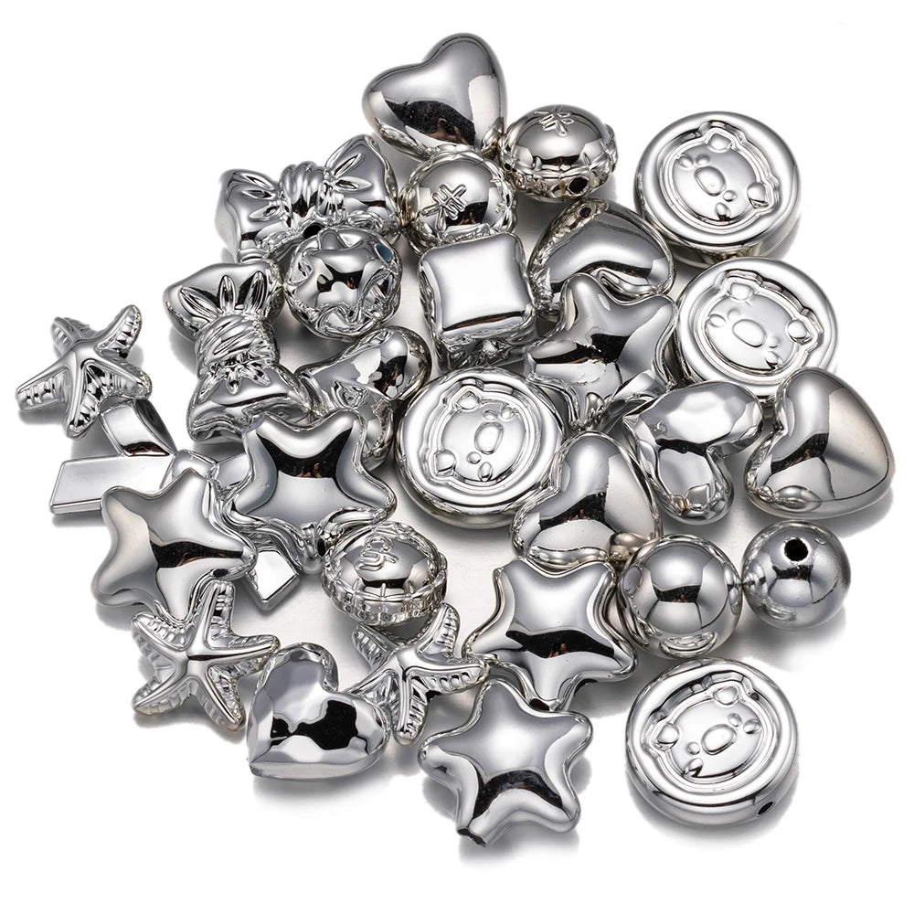 A collection of silver-toned acrylic bow and flower beads for DIY jewelry making