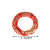Handmade red singing bowl cushion featuring gold embroidery